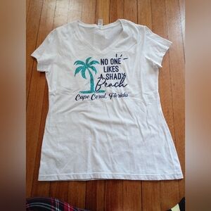 District White V-Neck Tee with Teal Palm Tree and Navy Cape Coral Graphic